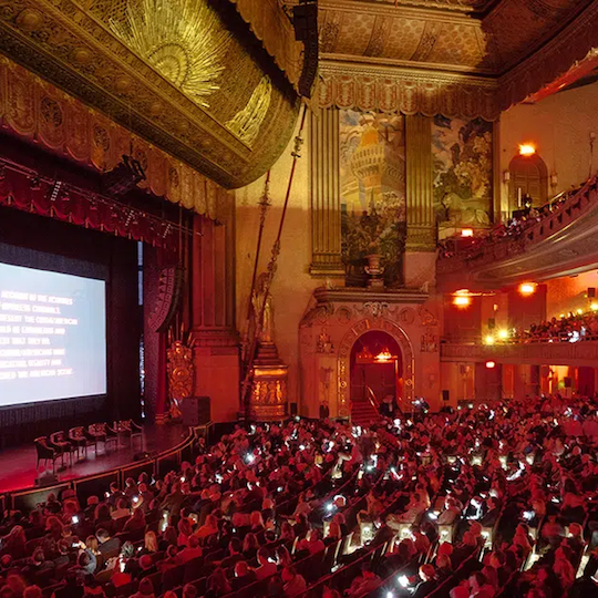 Tribeca Film Festival attendees sitting in the Beacon Theatre