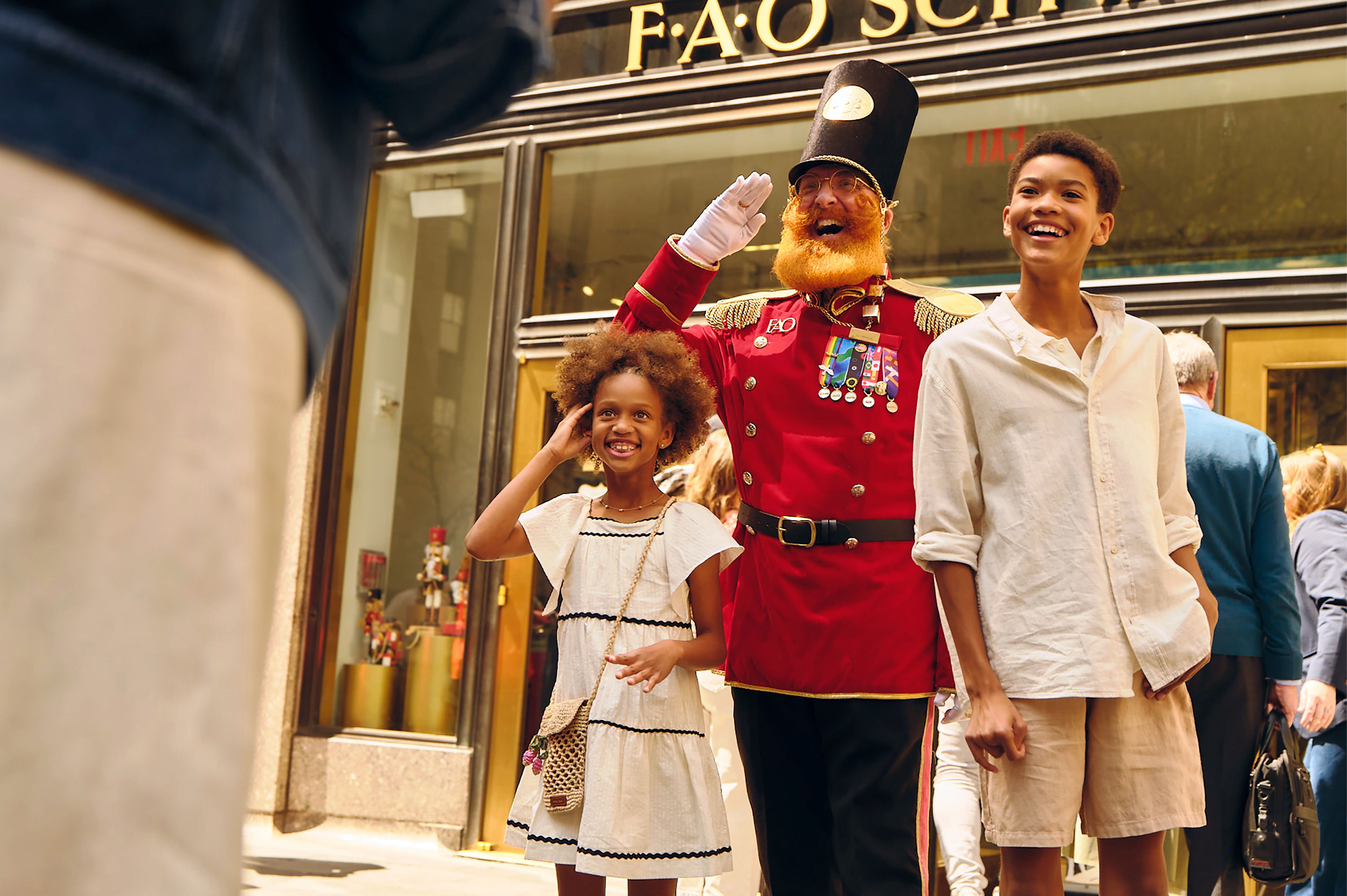 two kids posing for a picture with the FAO soldier