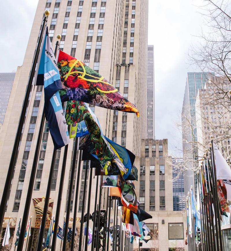 Flag Project 2022 entries on display around The Rink at Rockefeller Center