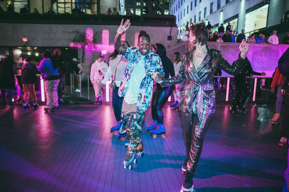 Two people roller skating together at Flipper's Roller Boogie Palace at The Rink during opening weekend