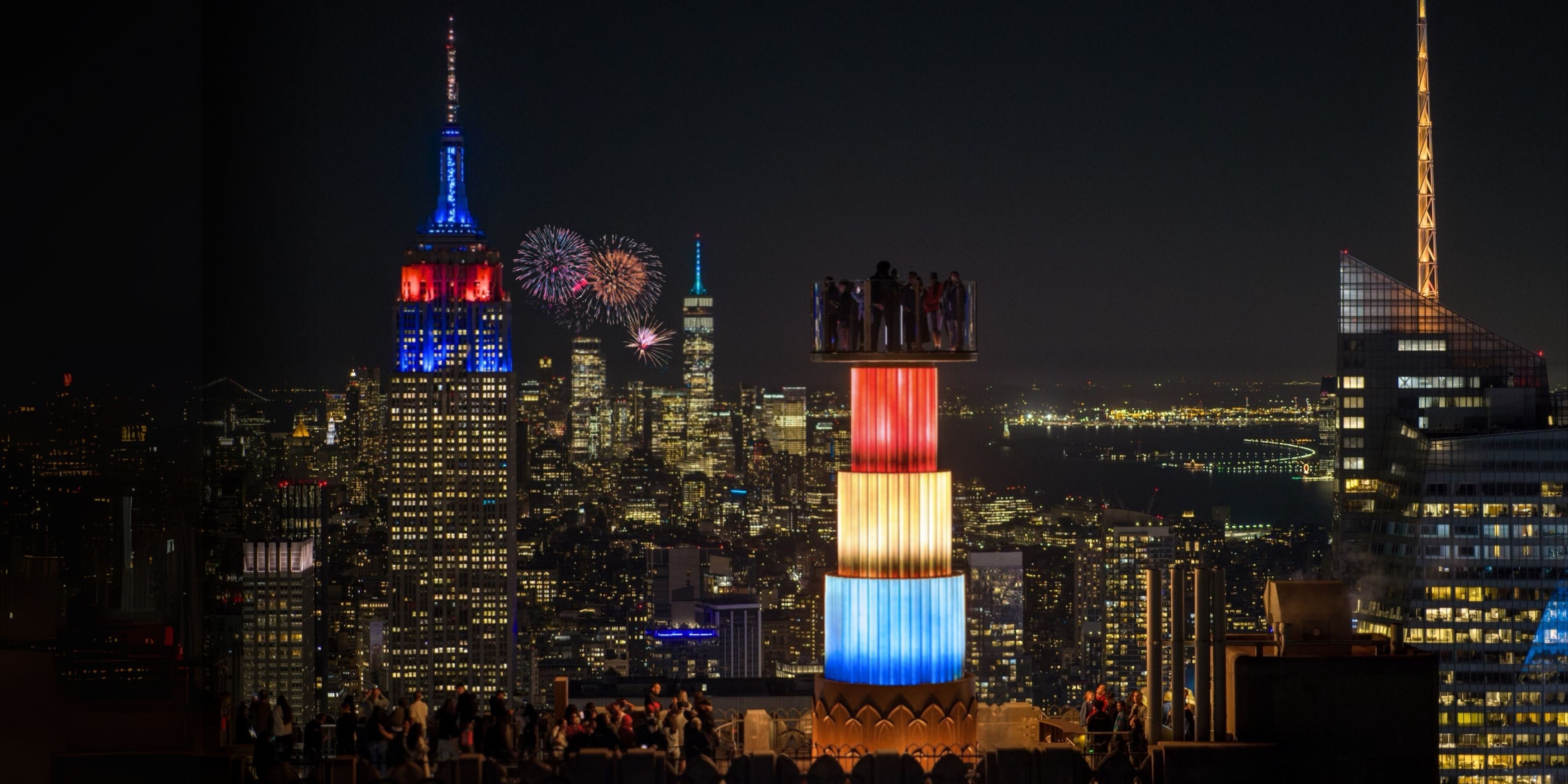 skylift lit up red white and blue over the new york city skyline