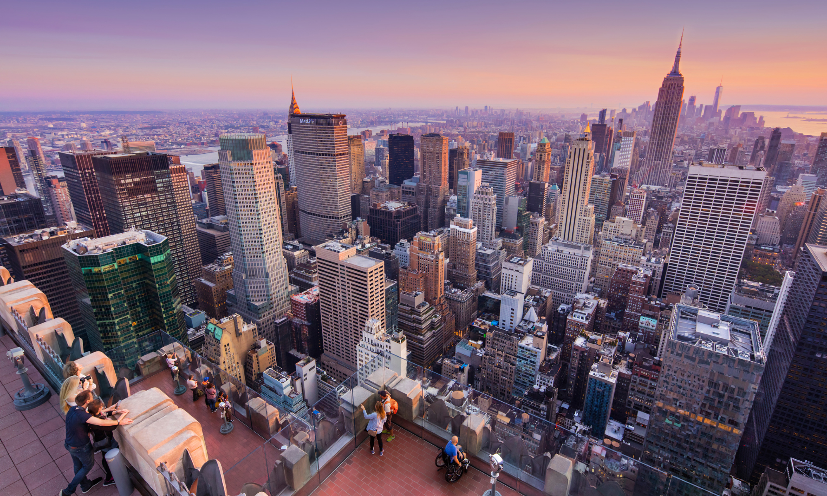 Aerial view of people visiting Top of the Rock at sunset