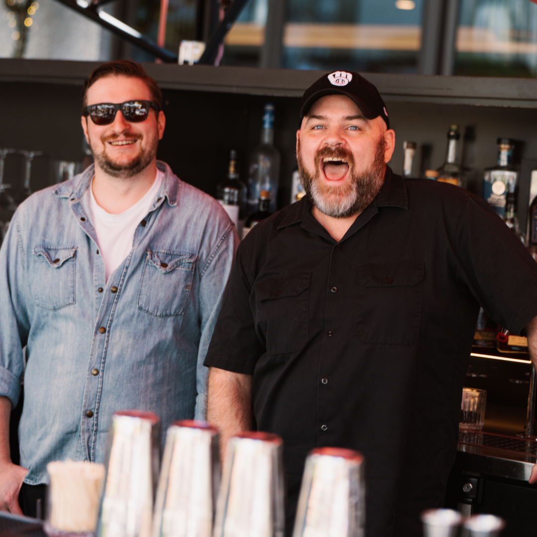 the bartenders of Pebble Bar smiling and having fun