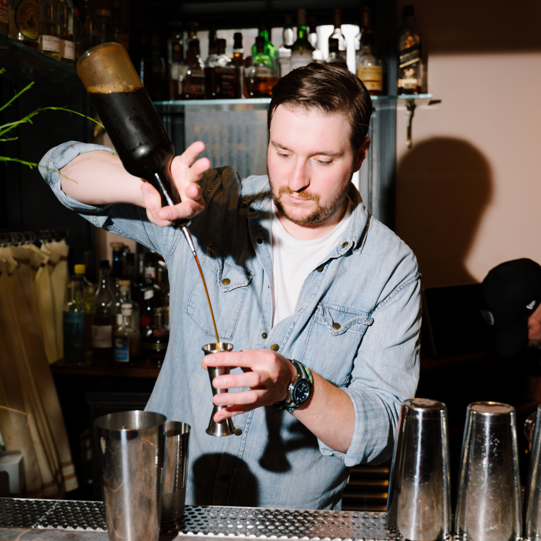 bartender pouring a shot