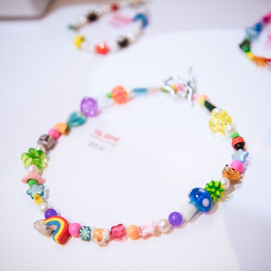 Ian Charms necklace on display
