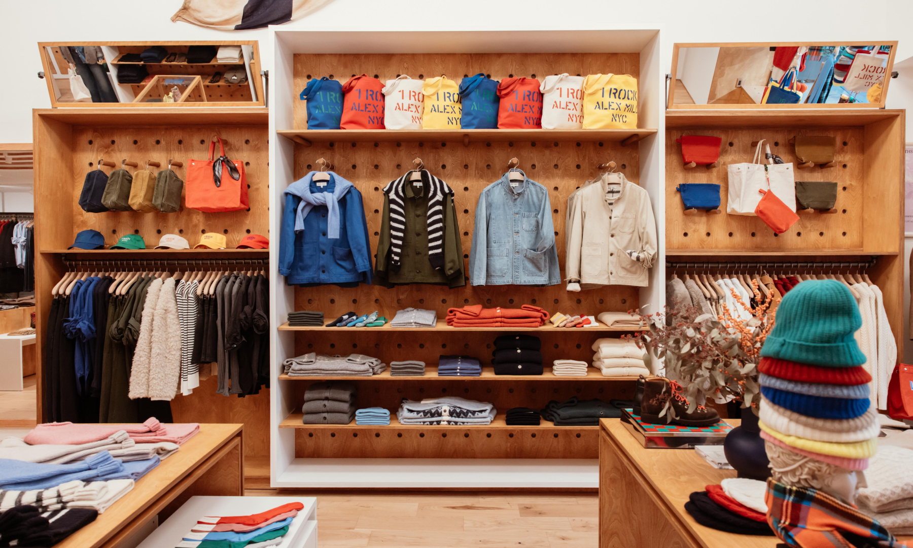 Various clothing items on display at Alex Mill at Rockefeller Center