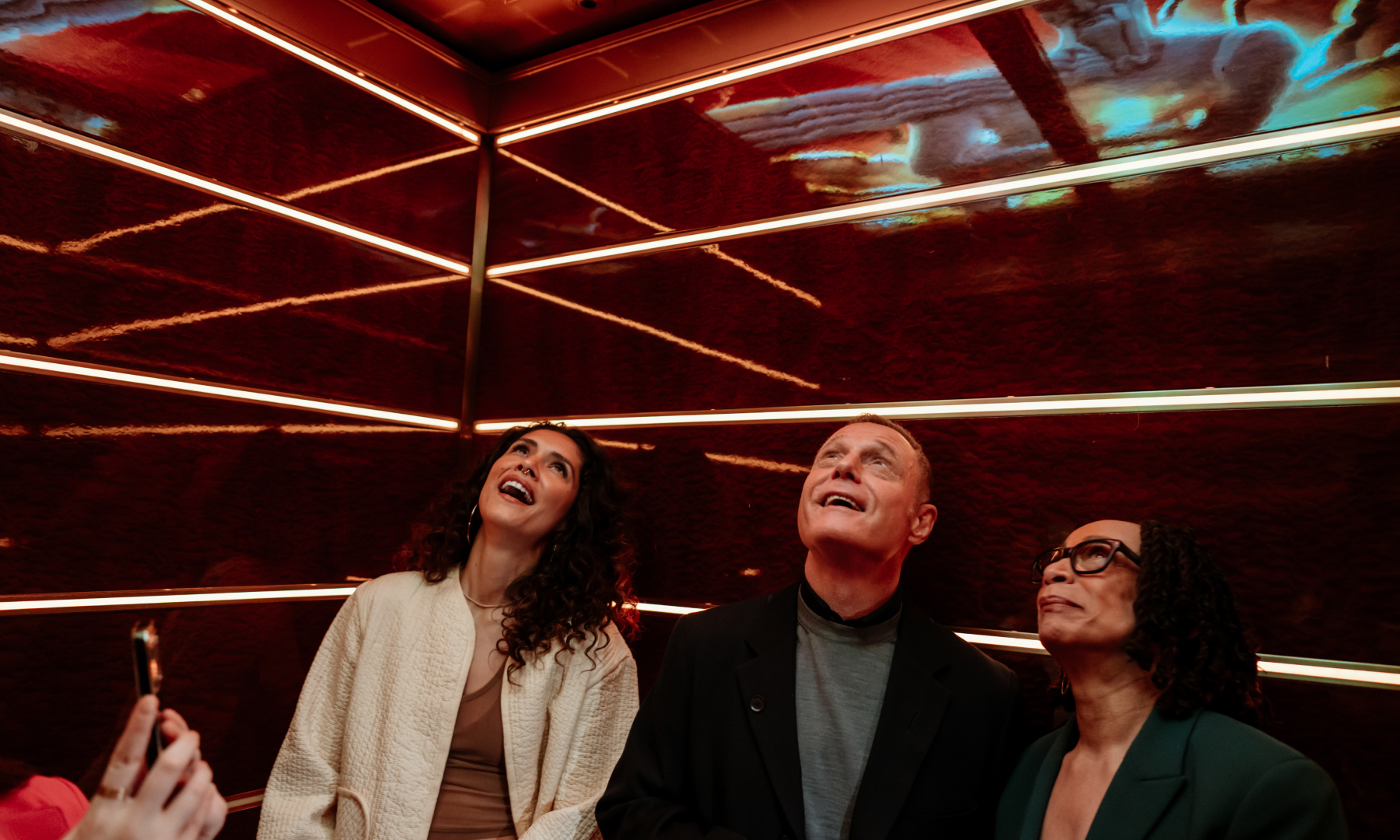 The cast of One Chicago inside the newly renovated Top of the Rock elevators