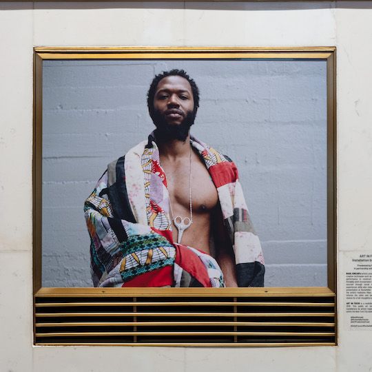 Photo of Basil Kincaid as part of the artist's Art in Focus exhibit at Rockefeller Center