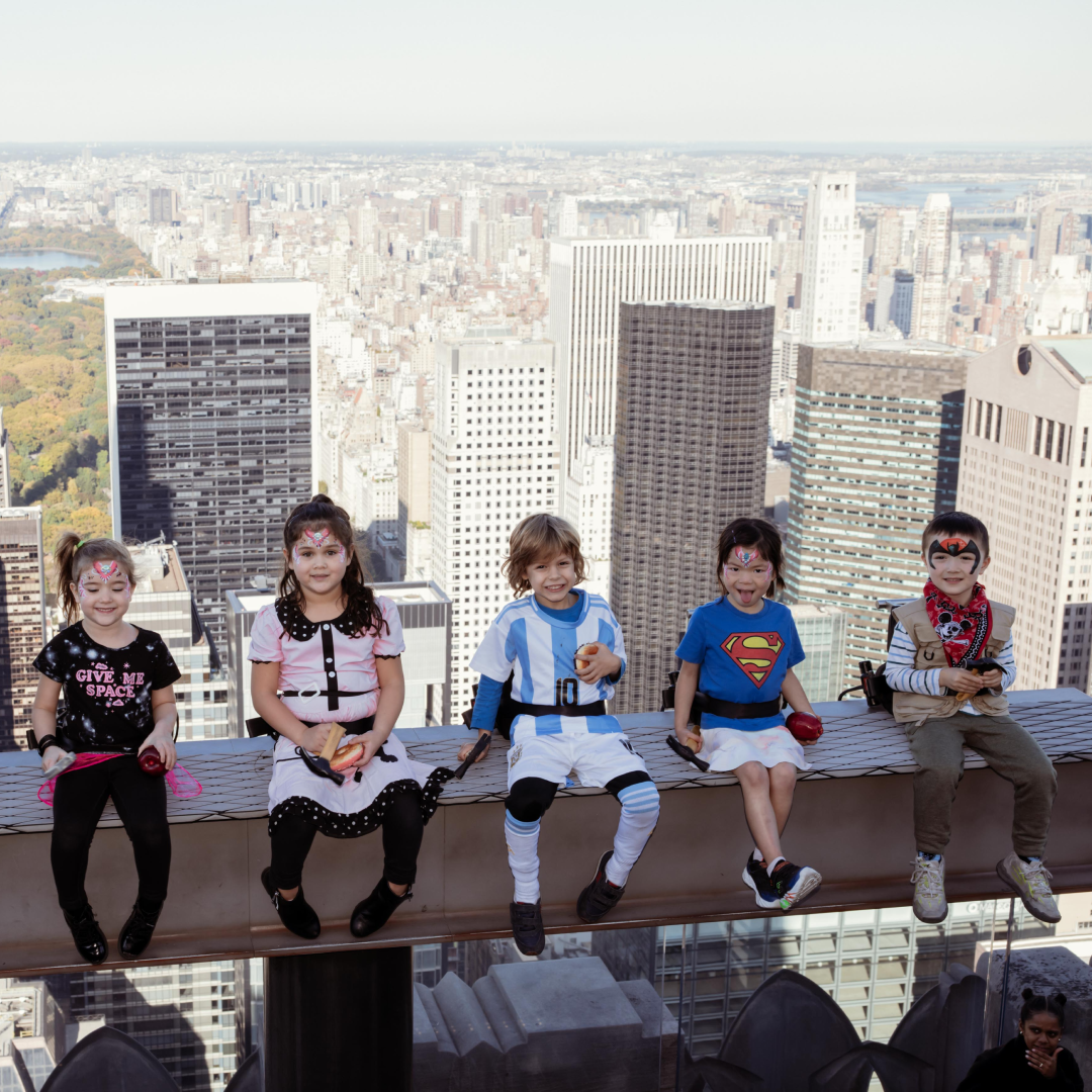 A group of kids on The Beam at Top of the Rock