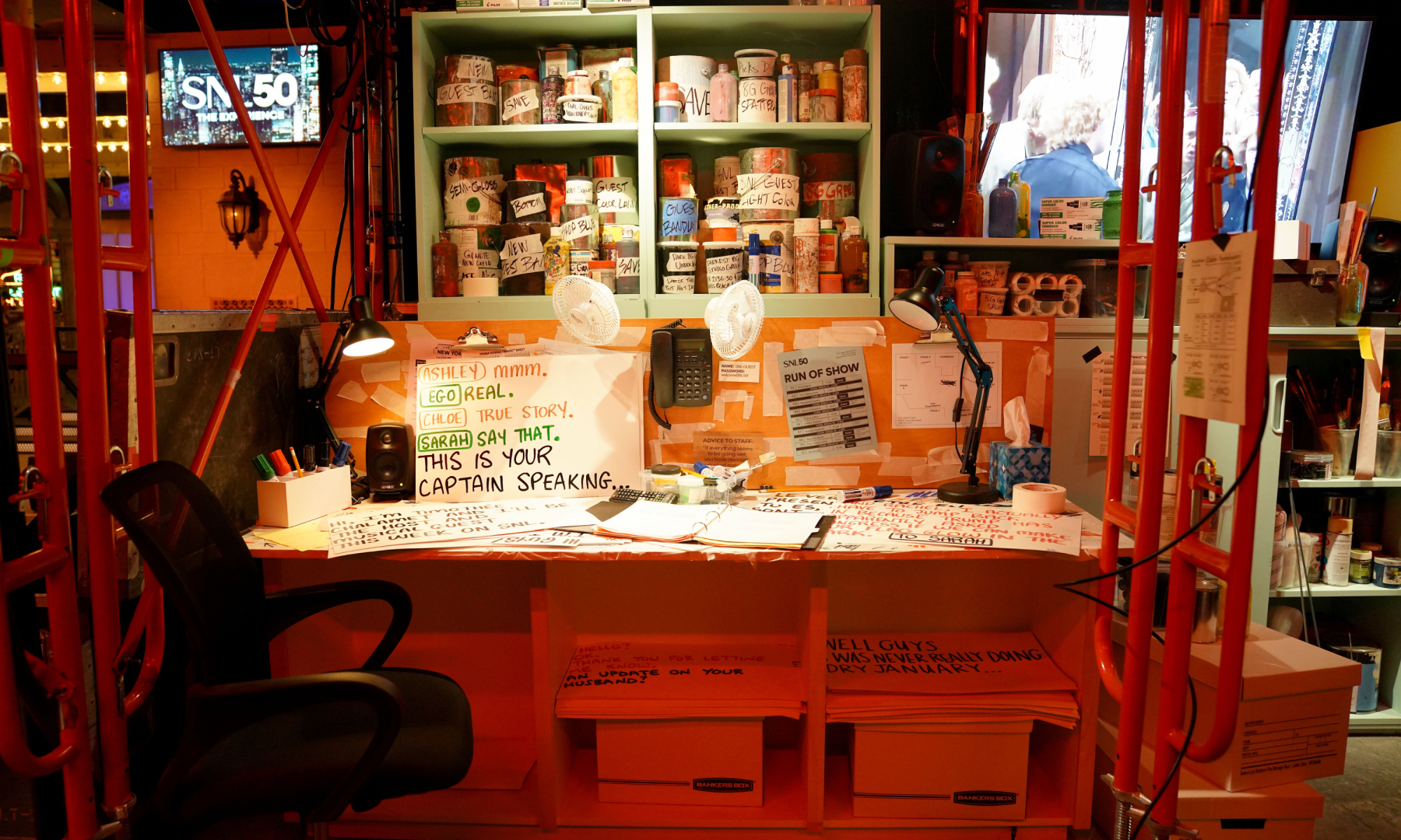 A desk with various items, including handwritten cue cards, at the 'Live from New York: The SNL50 Experience'