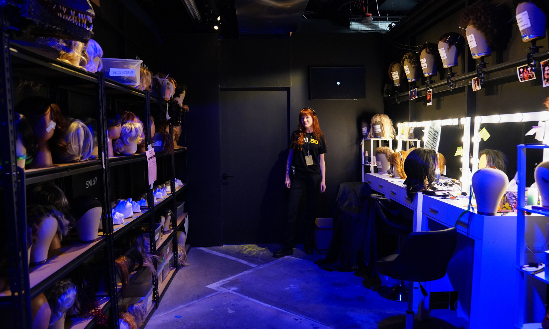 A person standing inside the hair and makeup room at the 'Live from New York: The SNL50 Experience'