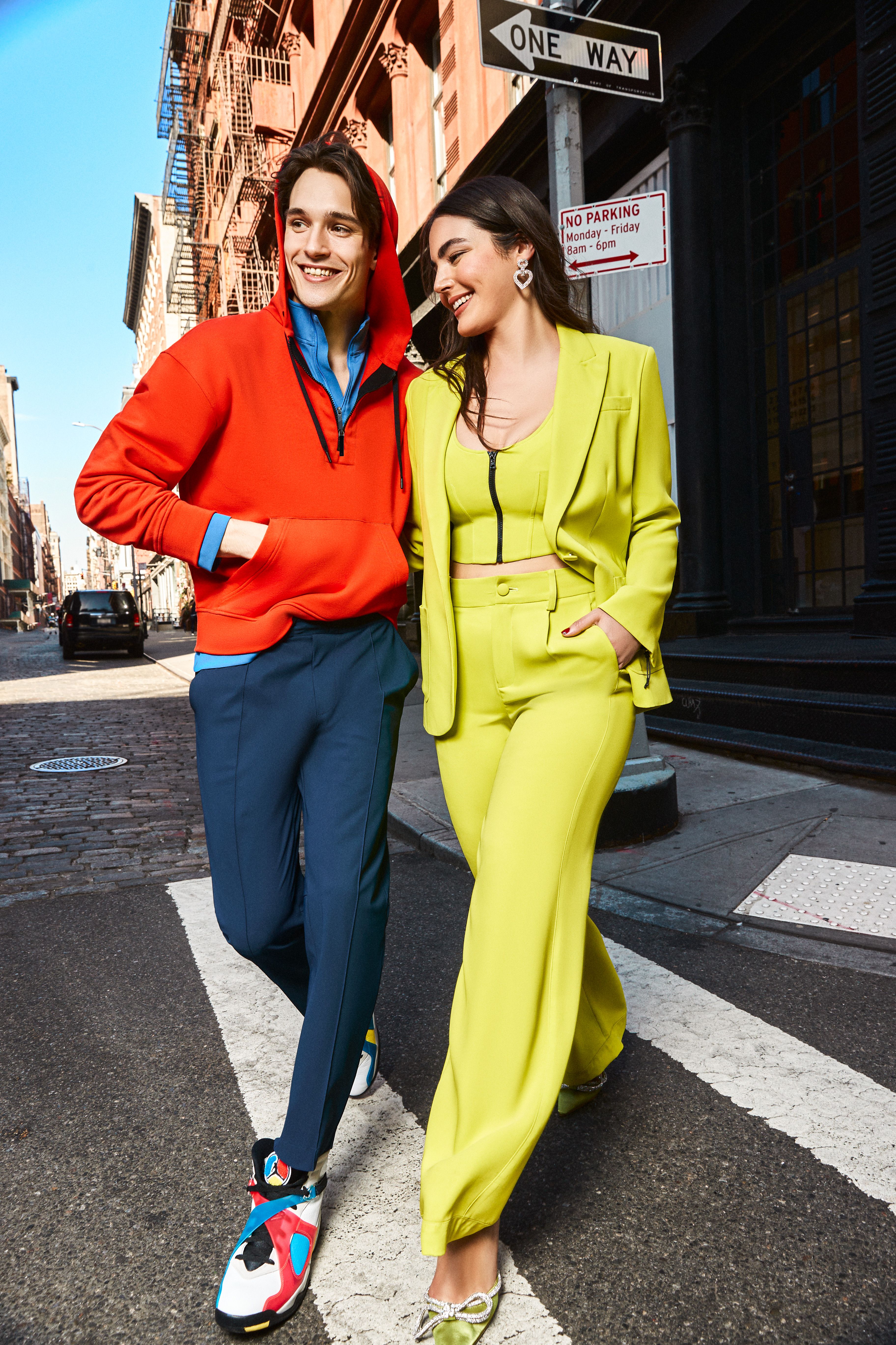 Man and woman crossing the street