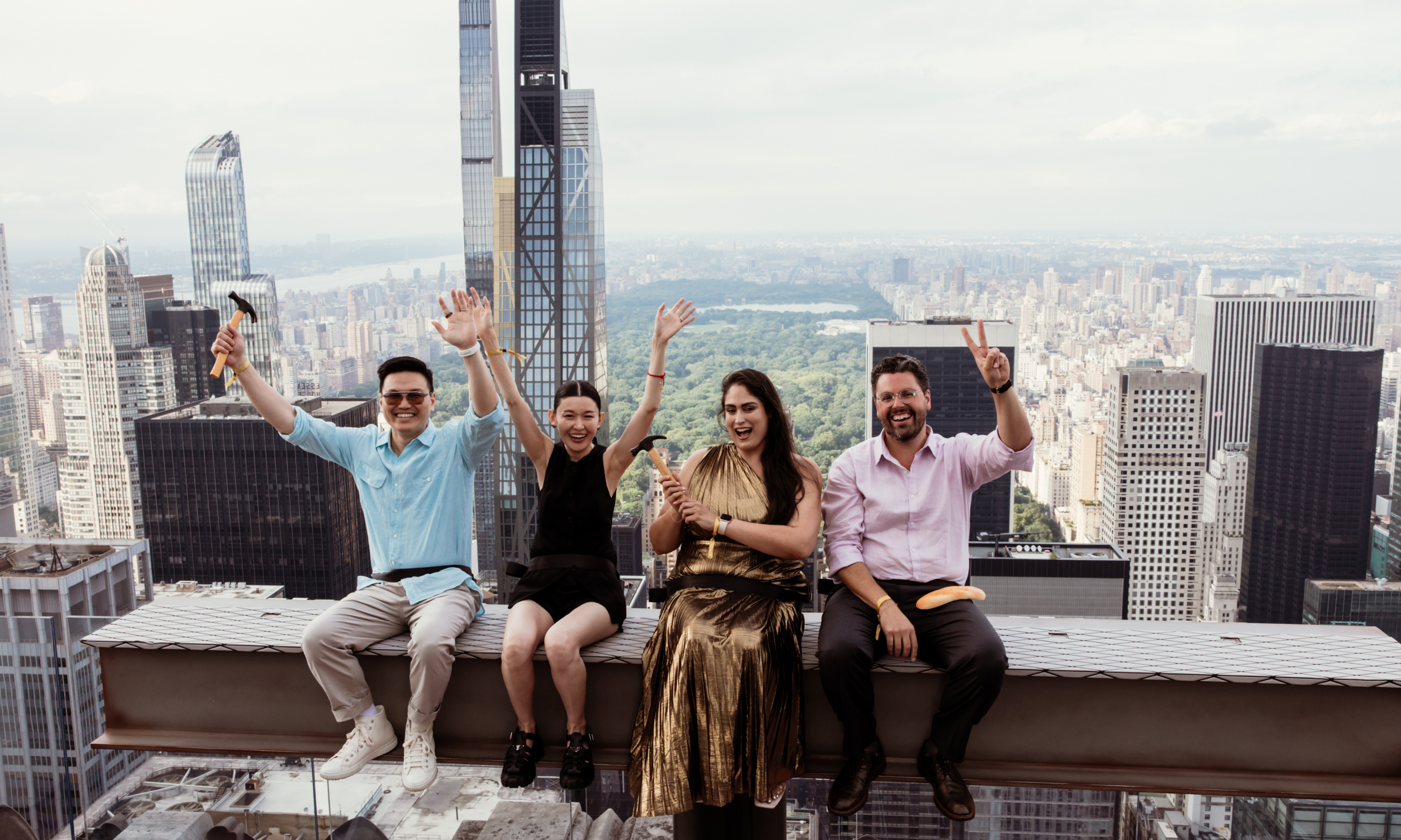 Four people on The Beam at Top of the Rock