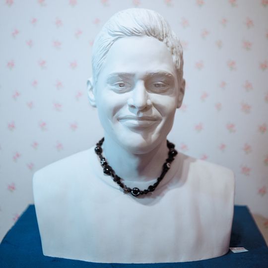 Necklace on display on a bust of Pete Davidson at Ian Charms at Rockefeller Center