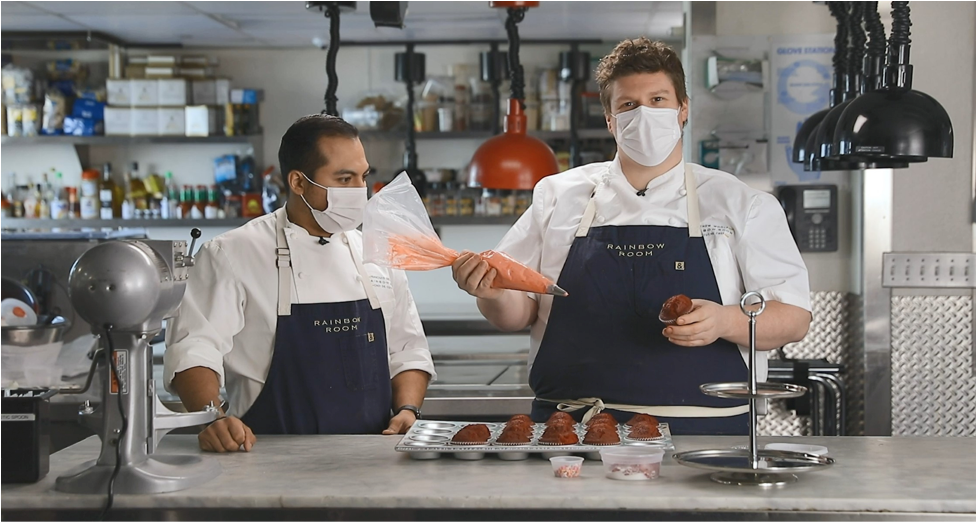 Chef Mat instructing a cupcake baking workshop