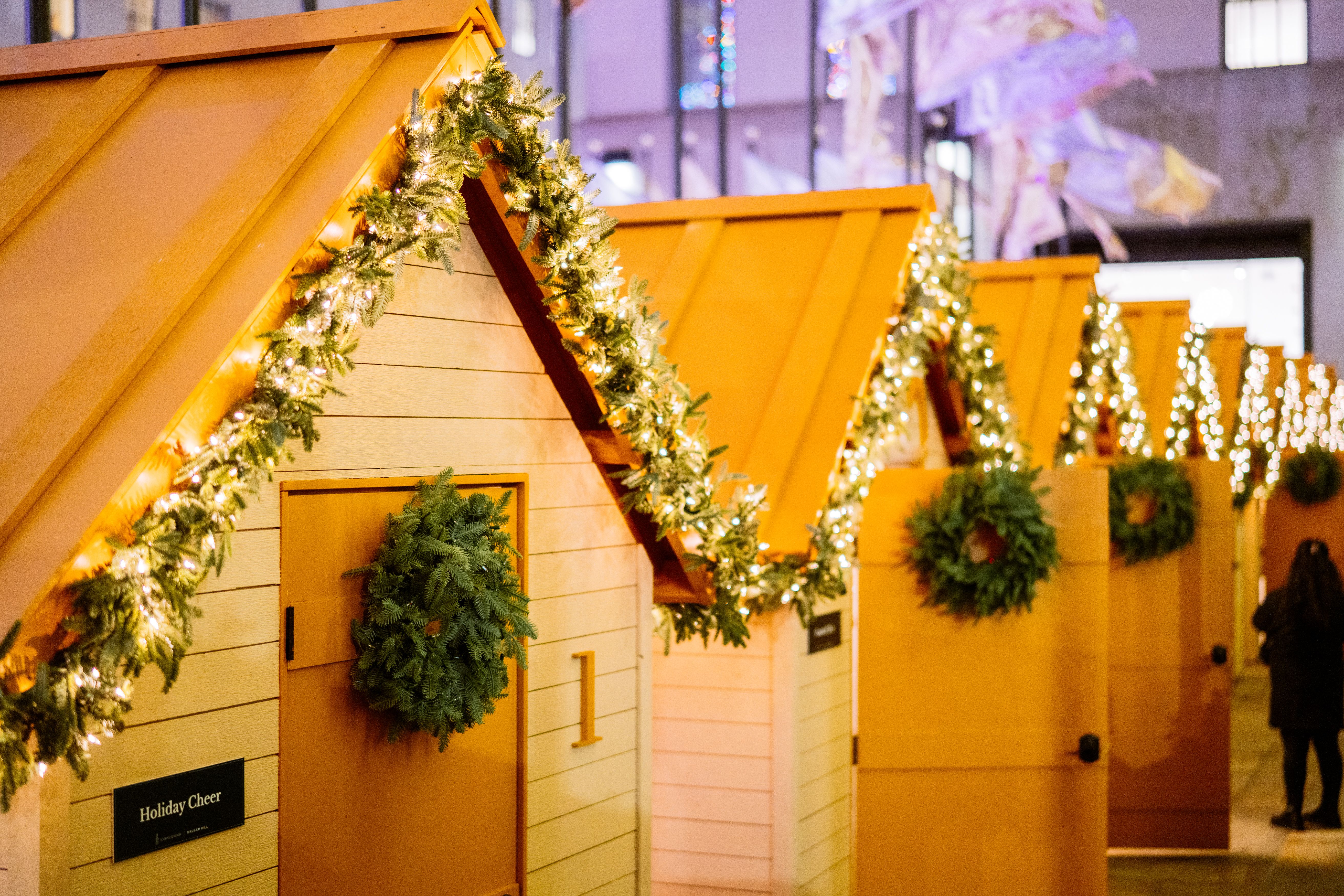 Rink-side chalet cabins decorated for the holidays