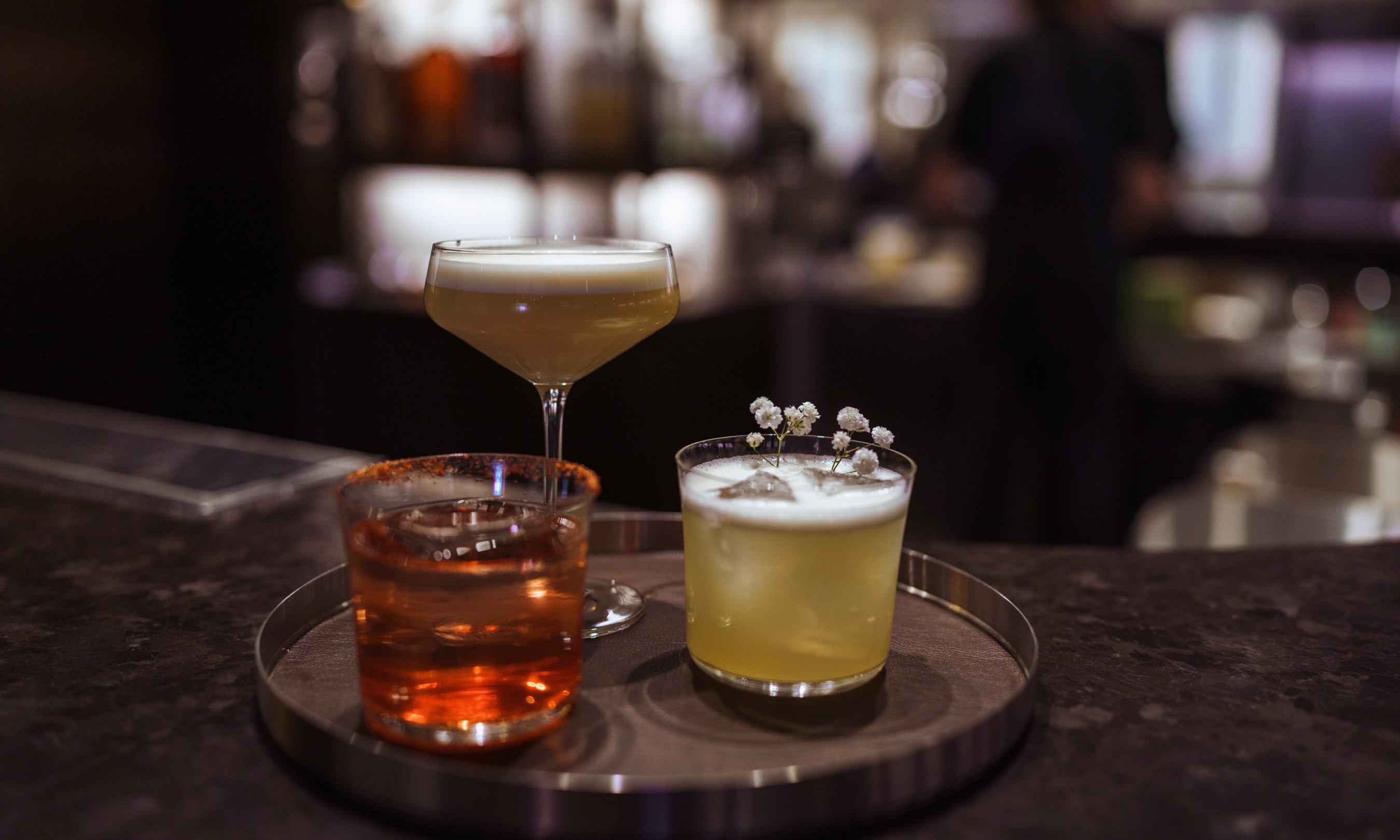 Trio of cocktails on a serving tray at NARO