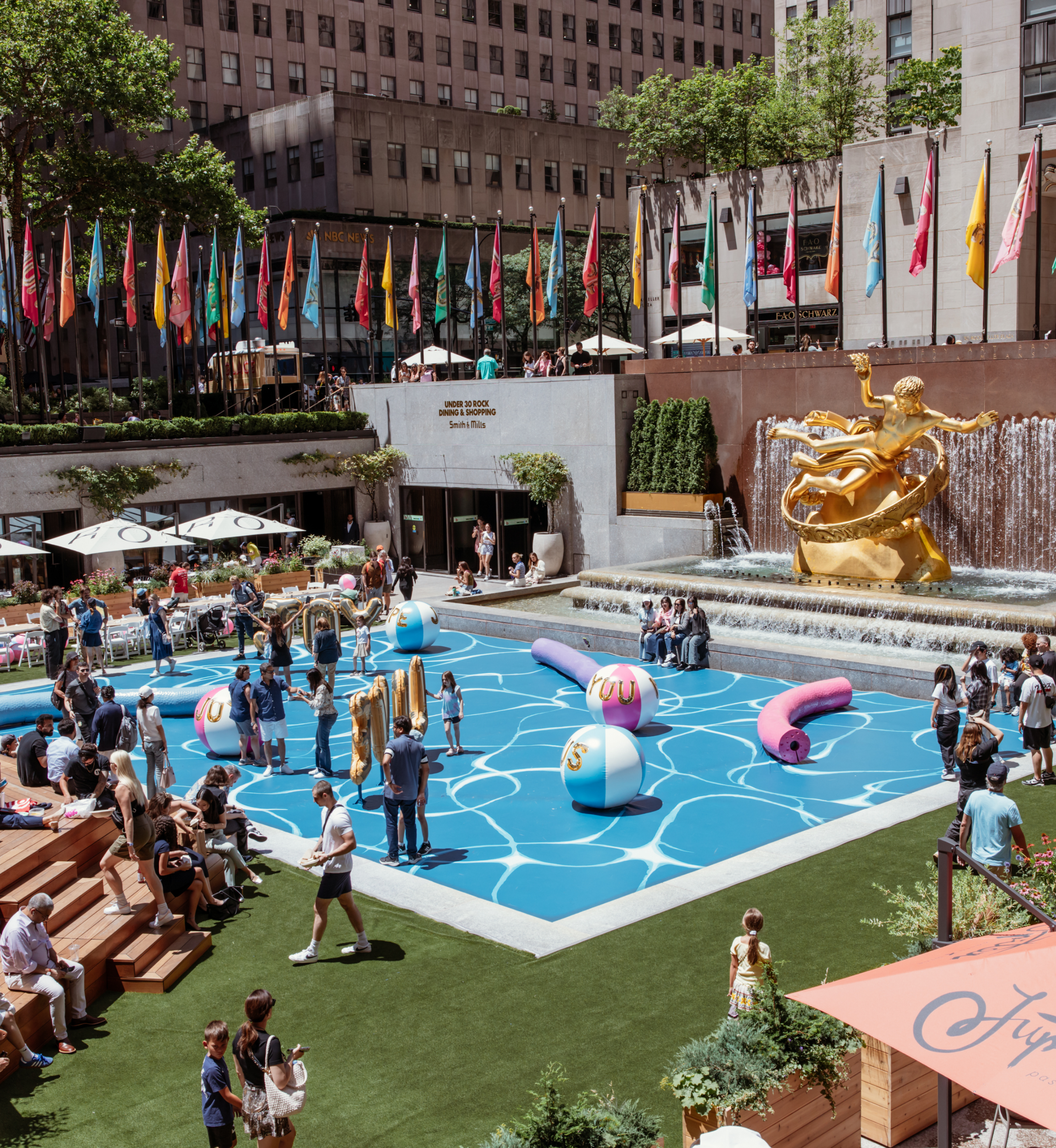 People experiencing artist Joel Mesler's public art installation "Pool Party" at The Rink