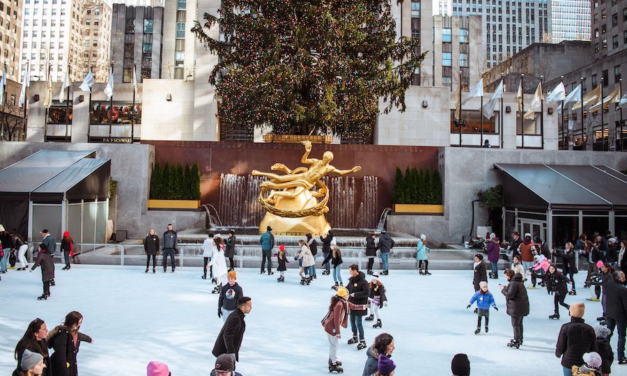 People ice skating at The Rink under the Rockefeller Center Christmas Tree