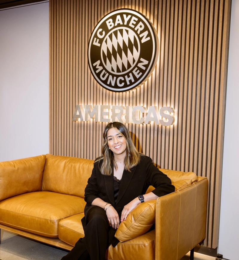 Dee Kundra, Managing Director (Americas) of FC Bayern, sitting on a couch