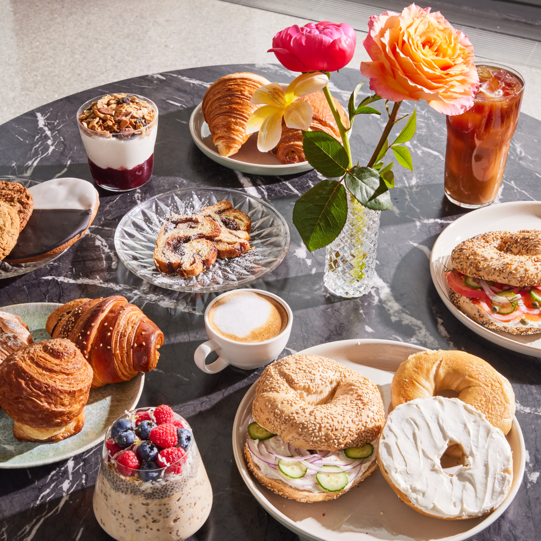 Various breakfast foods and drinks on a table at The Weather Room at Top of the Rock