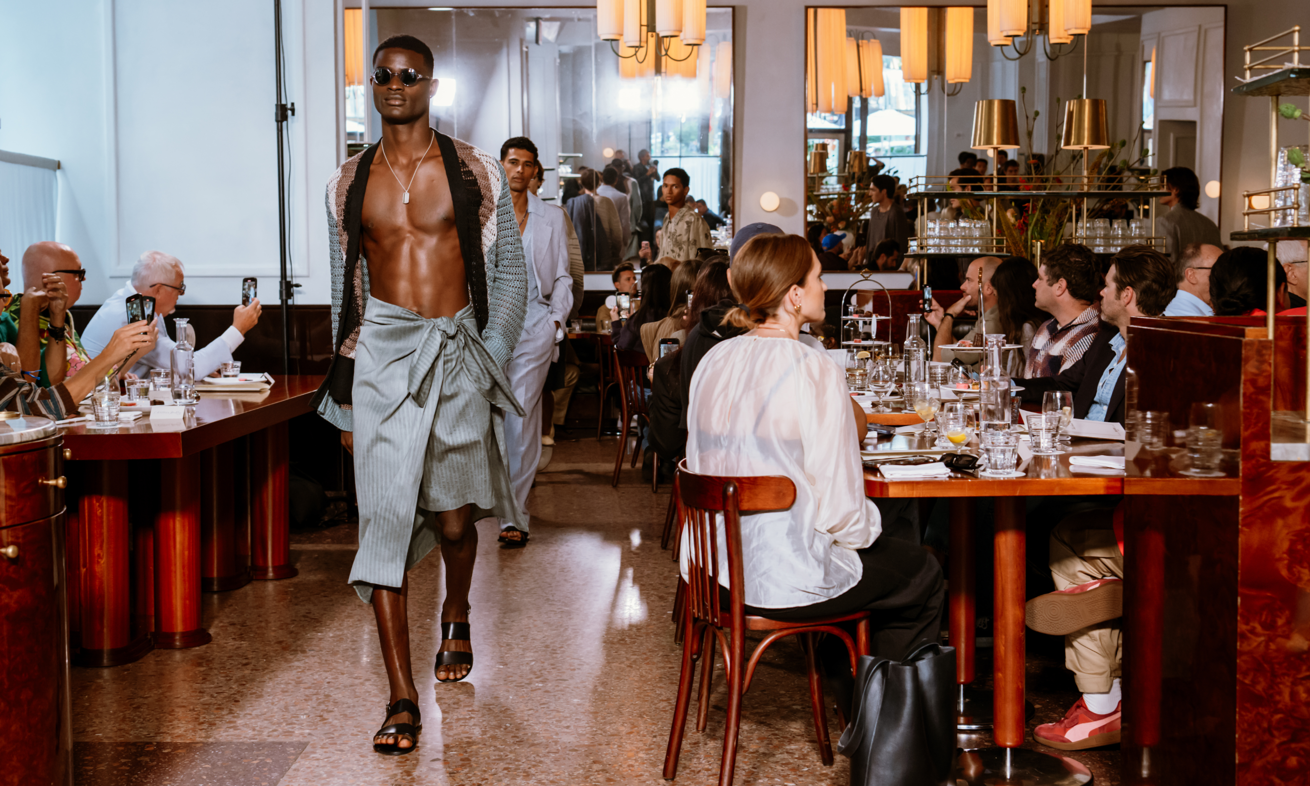 Model in a blue outfit walking in Todd Snyder's 2024 NYFW show at Le Rock