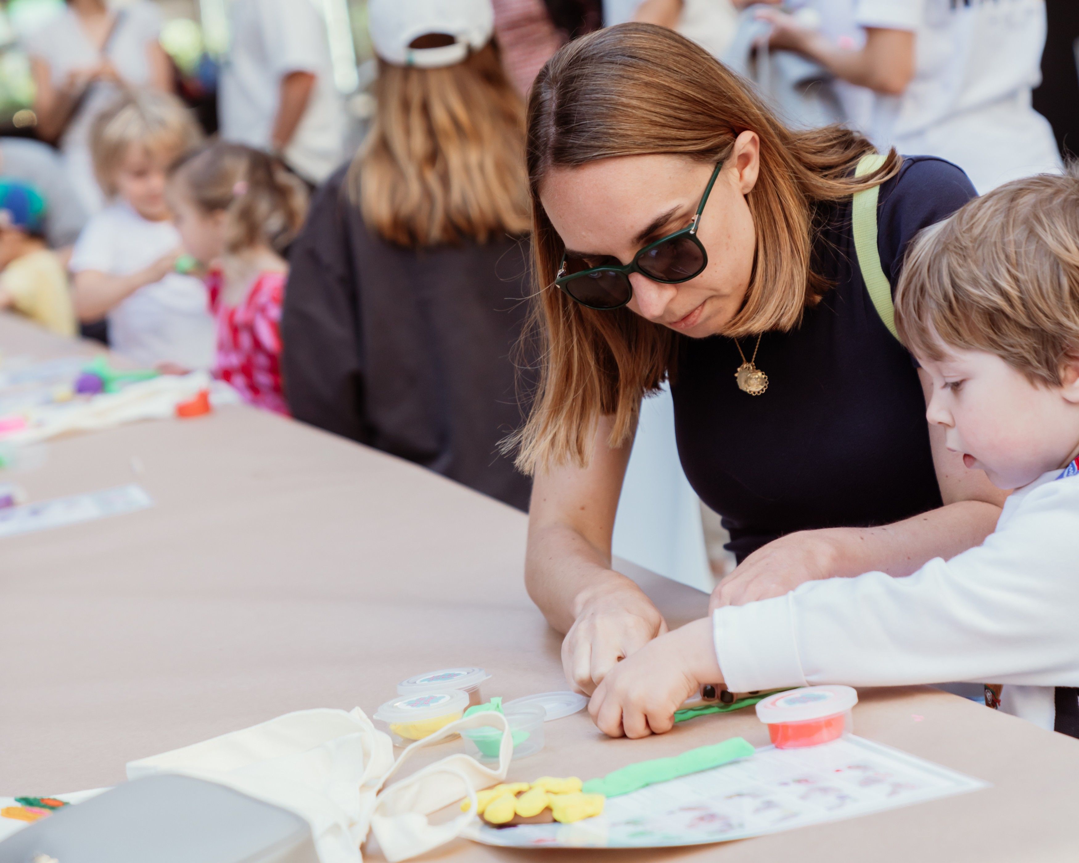 a mom and child working on an art project together