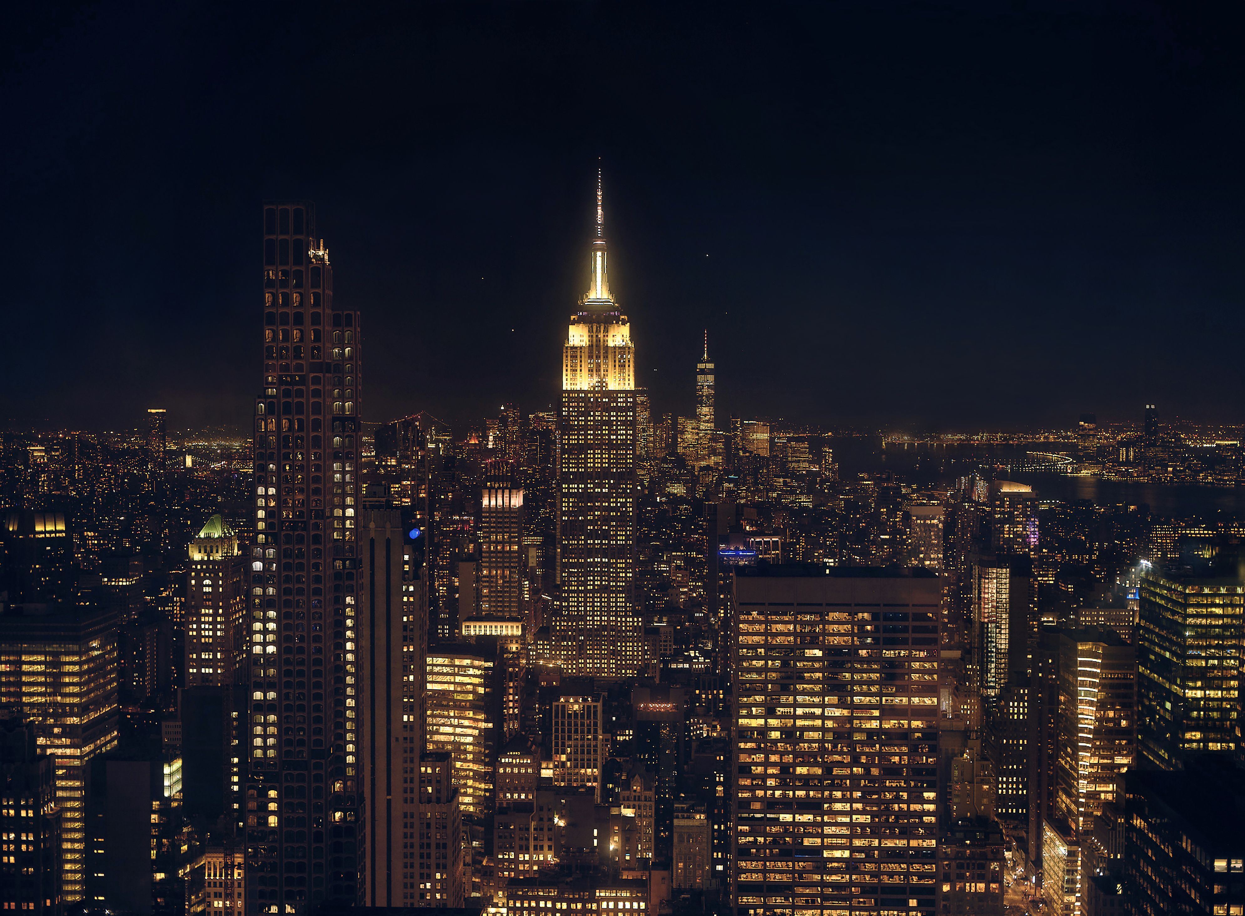view of the New York City skyline at night from Top of the Rock