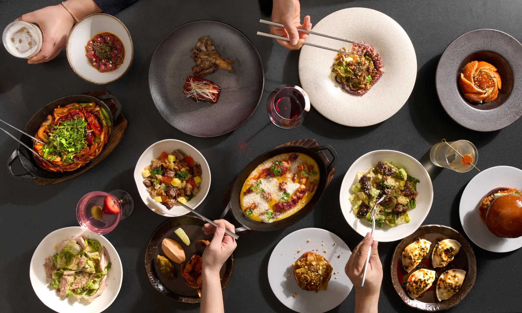 Various dishes and cocktails on a table from NARO at Rockefeller Center