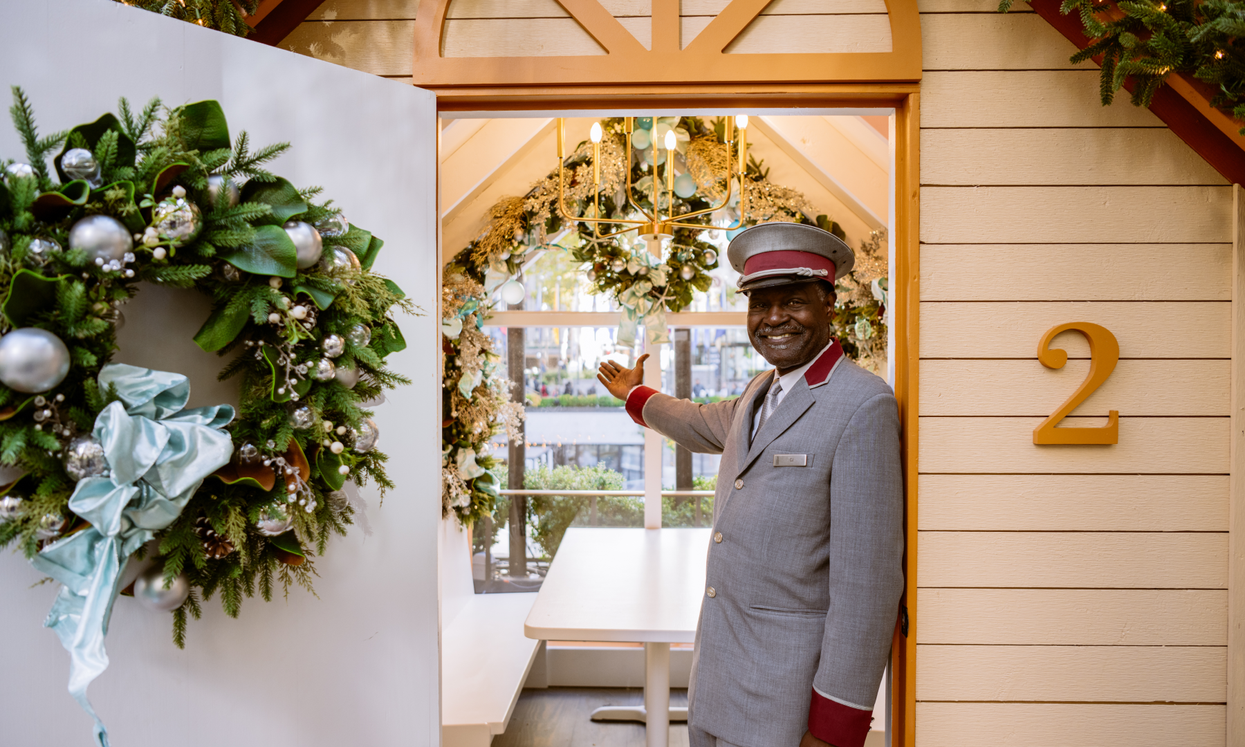 Correll Jones, Mayor of Rockefeller Center, standing in front of an Après Skate Chalet presented by Balsam Hill