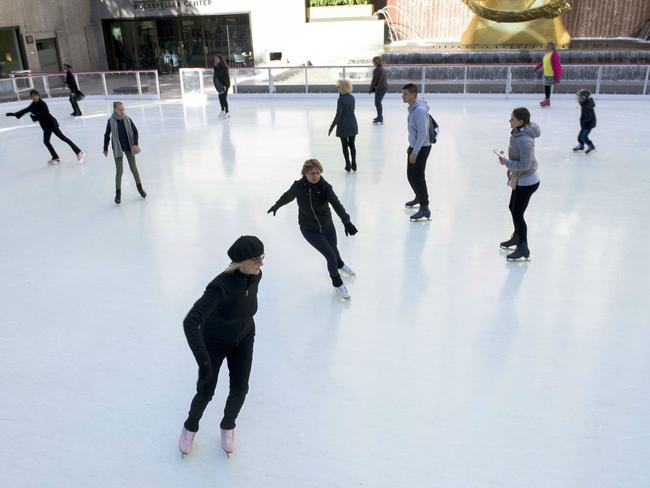 Women skating at the Rink at Rockefeller Center
