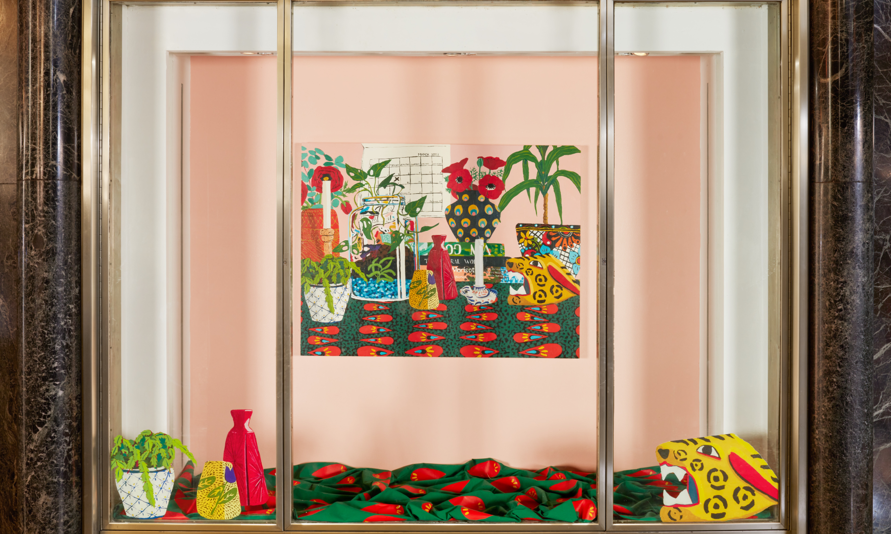 A vitrine display of artwork by Hilary Pecis at Rockefeller Center