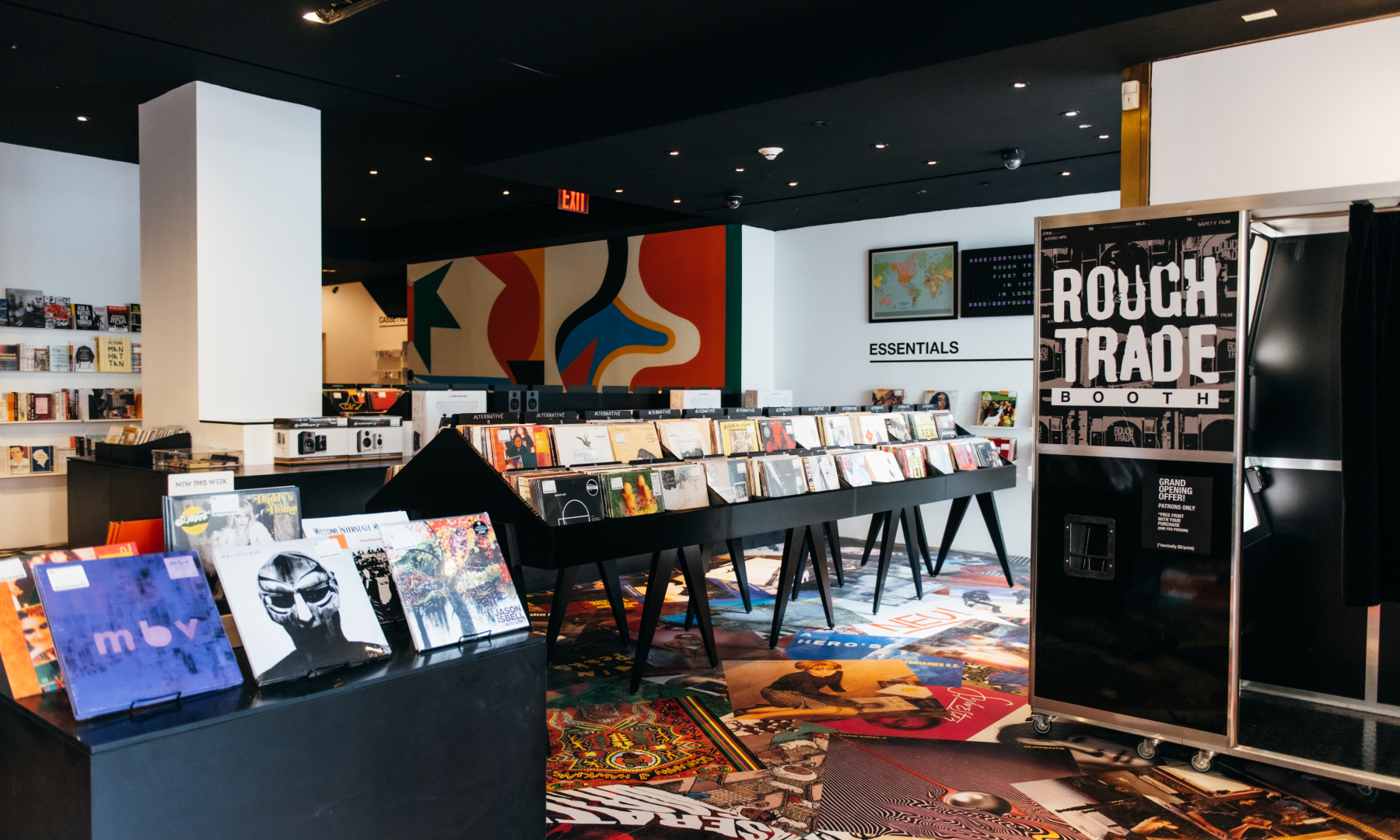 Display cases of records and a photo booth at Rough Trade Above
