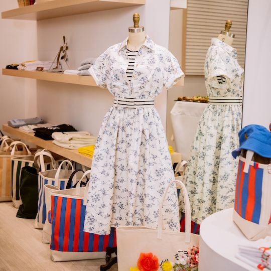 Floral dress styled with a black-and-white striped t-shirt and belt from Kule