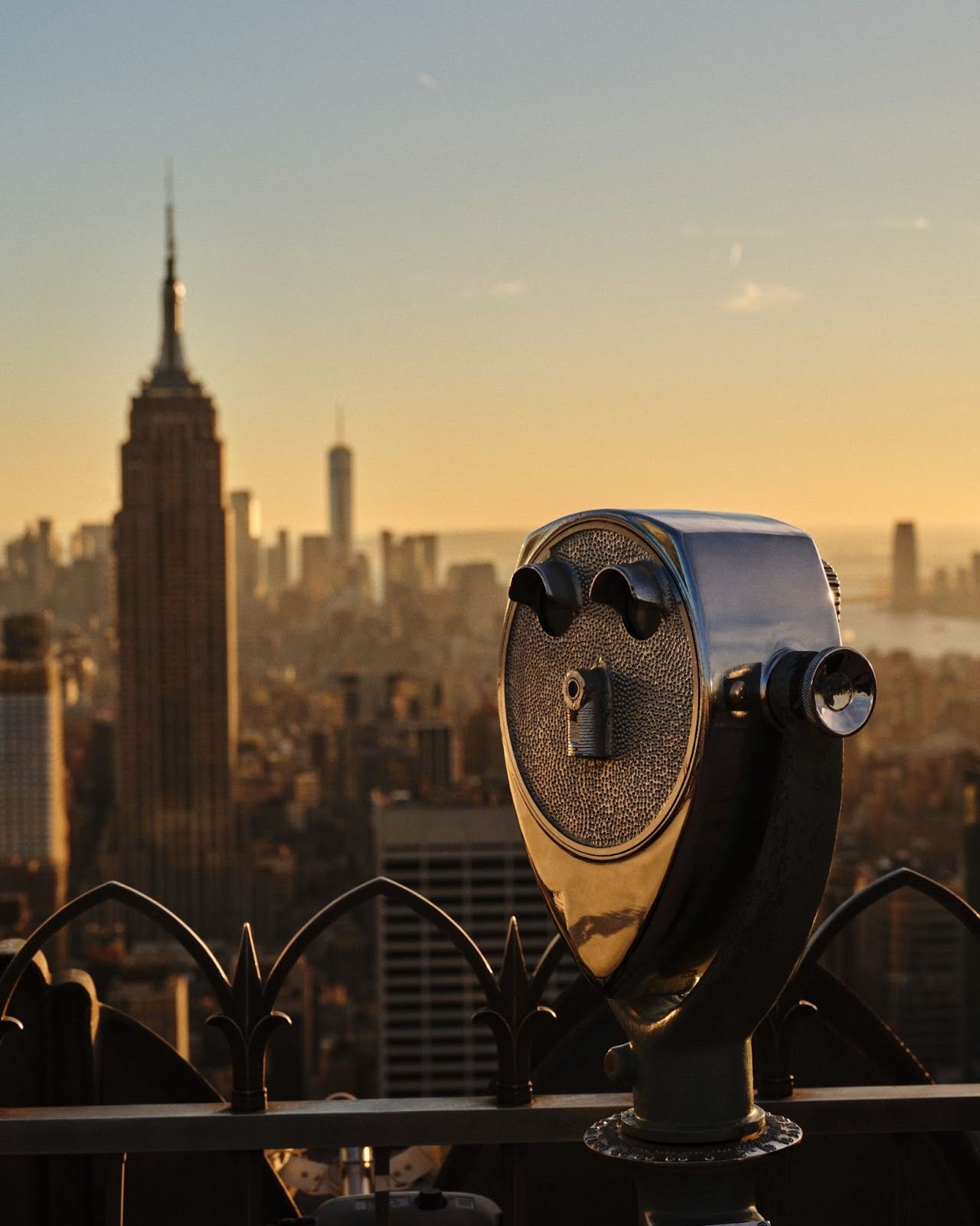 observation deck overlooking skyscrapers at sunrise
