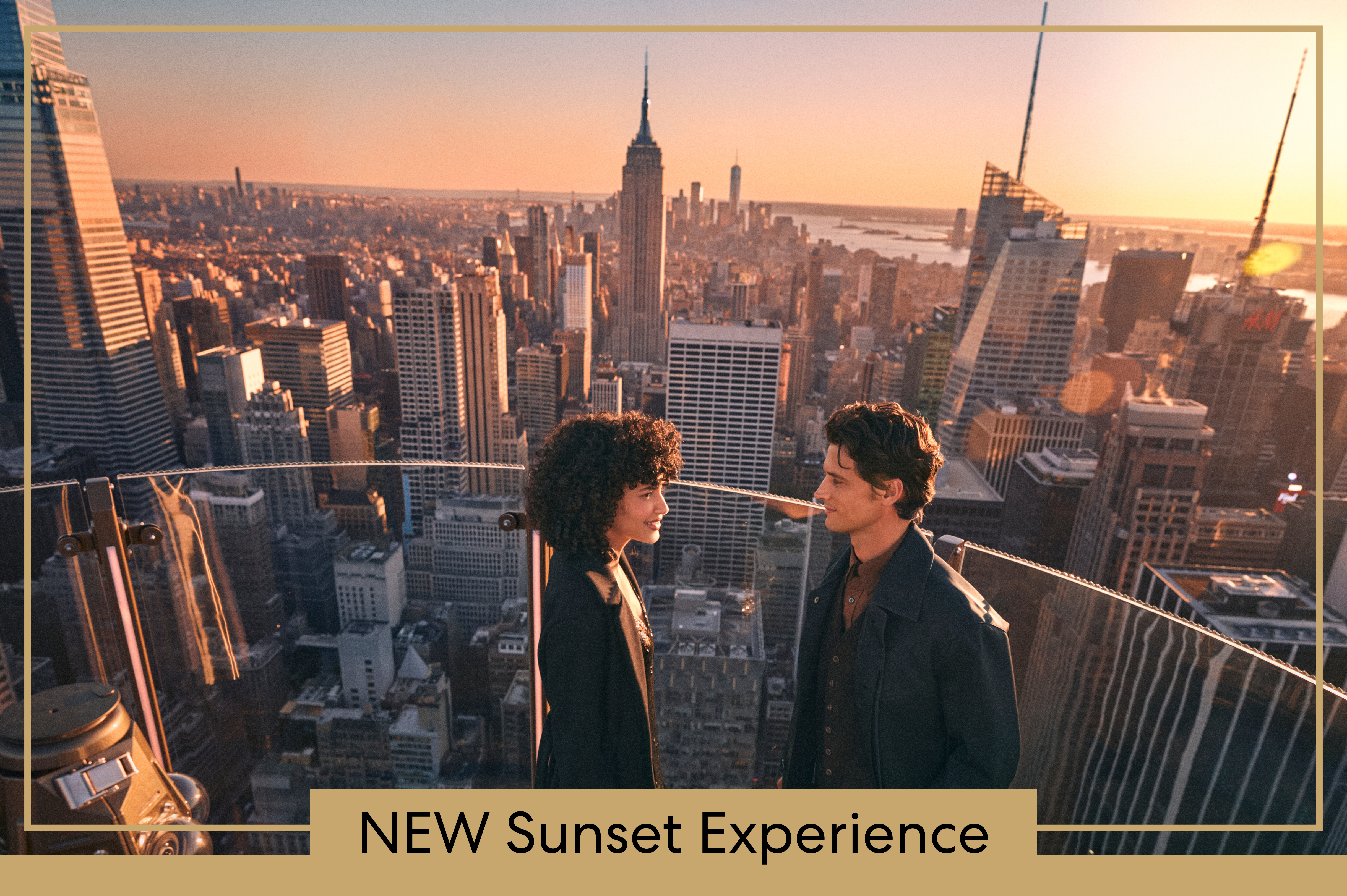 Couple overlooking skyline at sunset