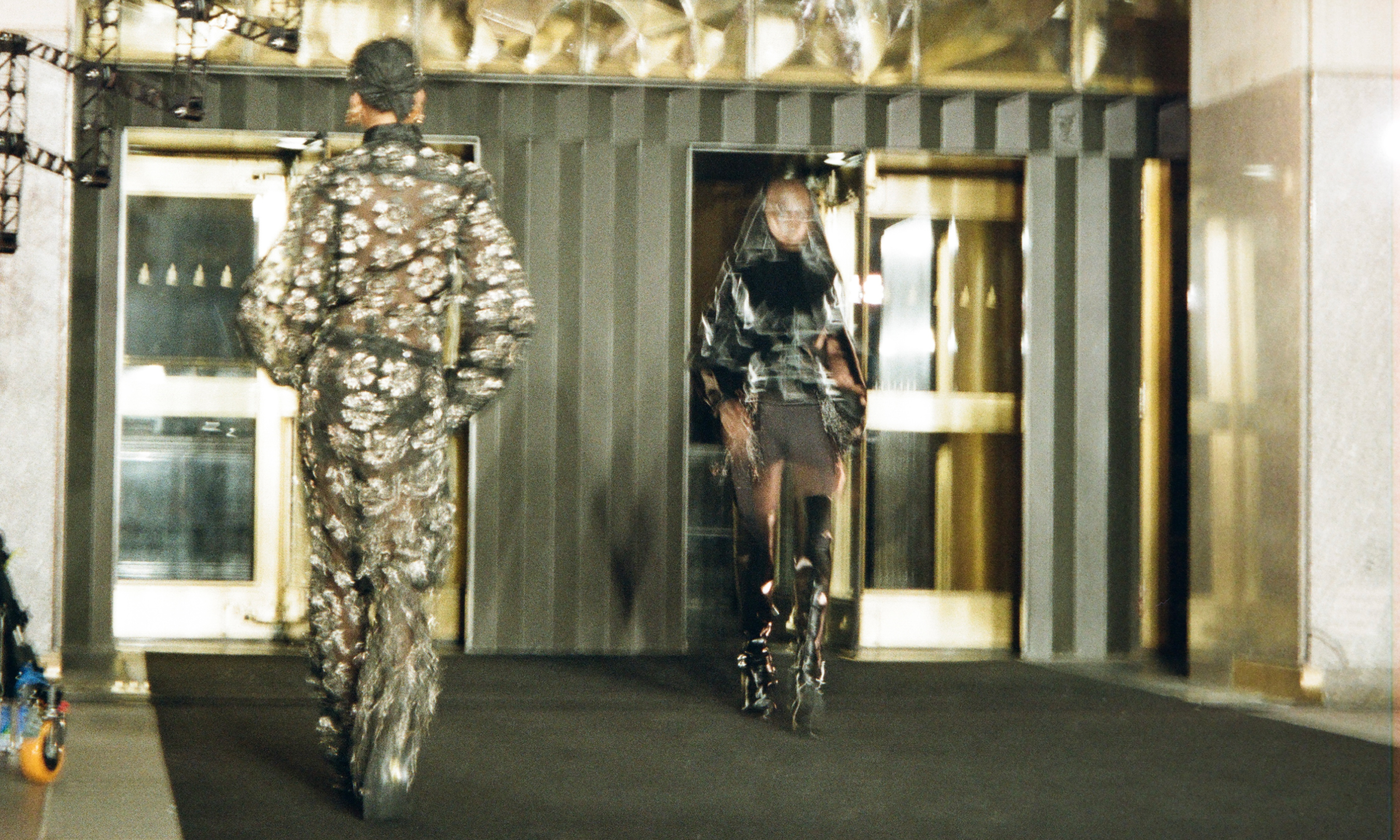 Two models walking in LUAR's 2024 NYFW show at Rockefeller Center