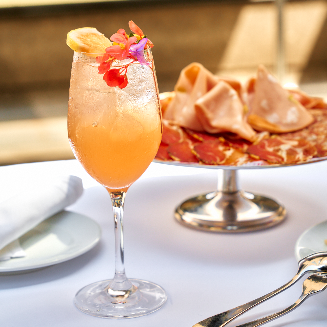 A spritz and a plate of assorted meats from Lodi at Rockefeller Center