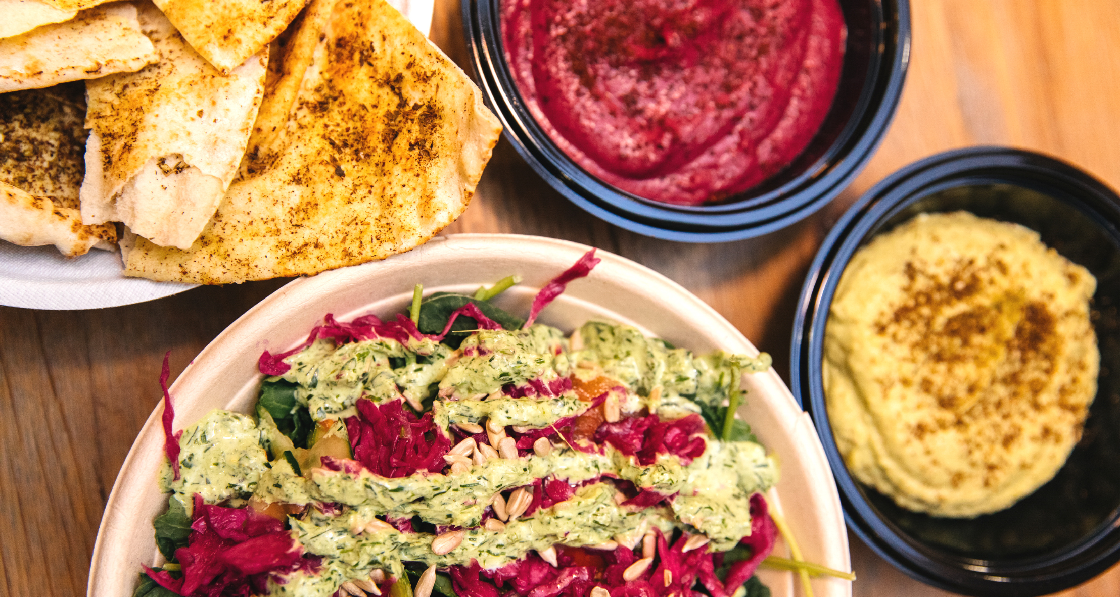 Kale Fattoush salad with Tahini Caesar dressing, Pita and Roasted Beet Dip and Avocado Hummus did from Samesa