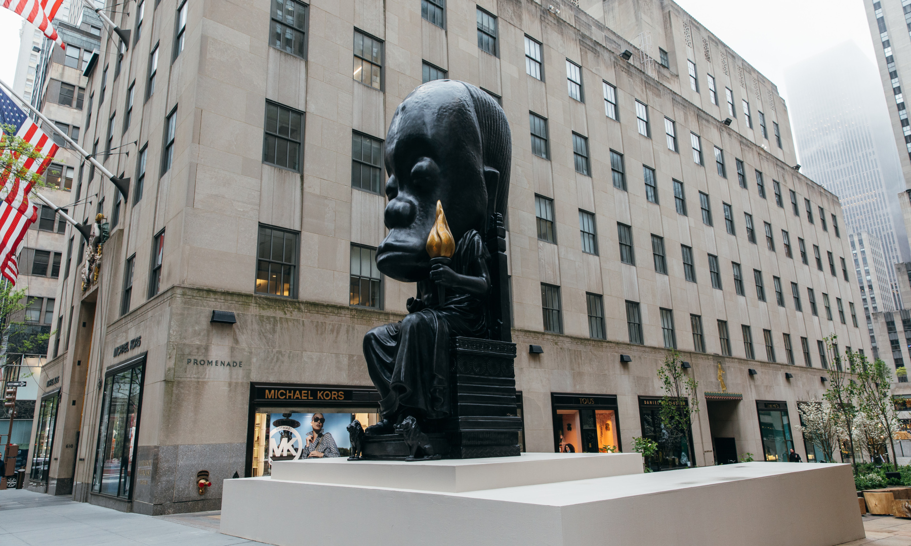 A side profile view of Sanford Biggers' "Oracle" statue at Rockefeller Center
