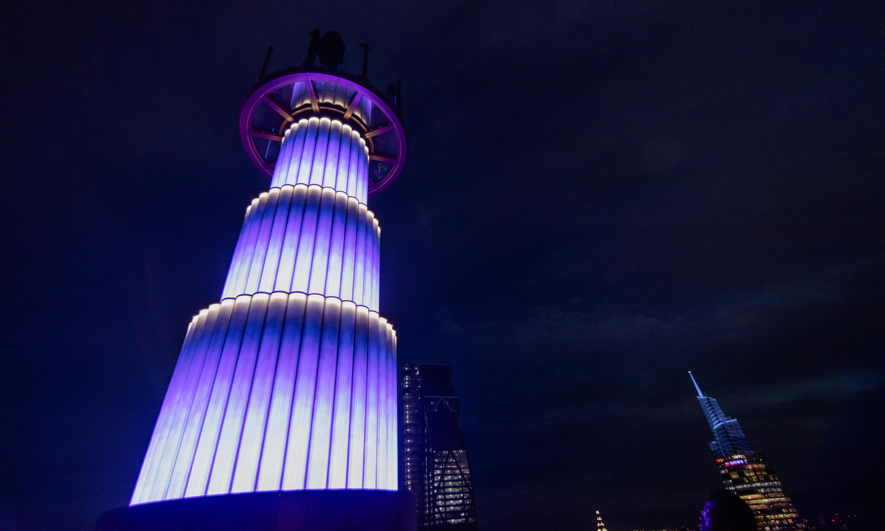 Purple lights from Skylift's evening light show