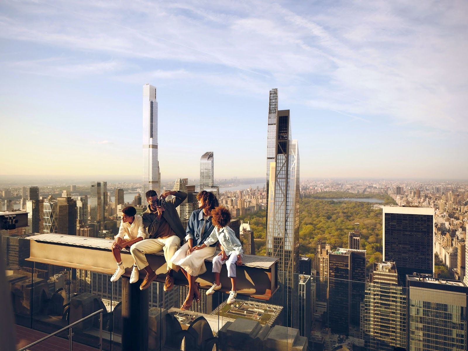 A family on The Beam at Top of the Rock