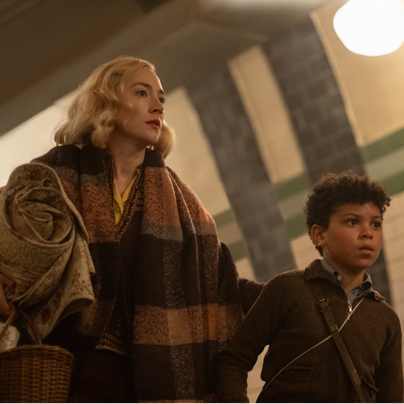 Still of actress Saoirse Ronan and a child actor in "Blitz"