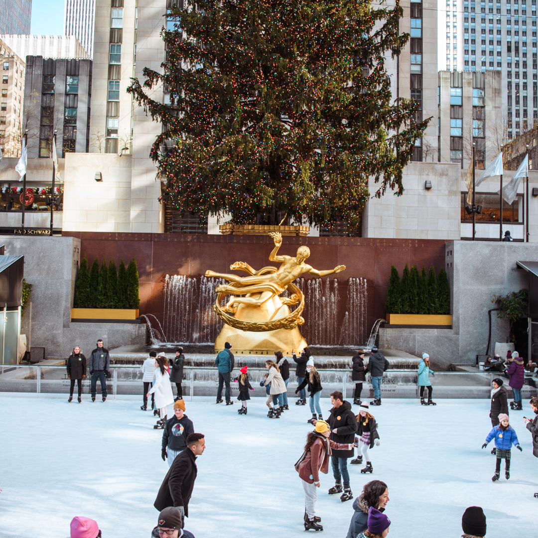 People ice skating on The Rink under the Rockefeller Center Christmas Tree
