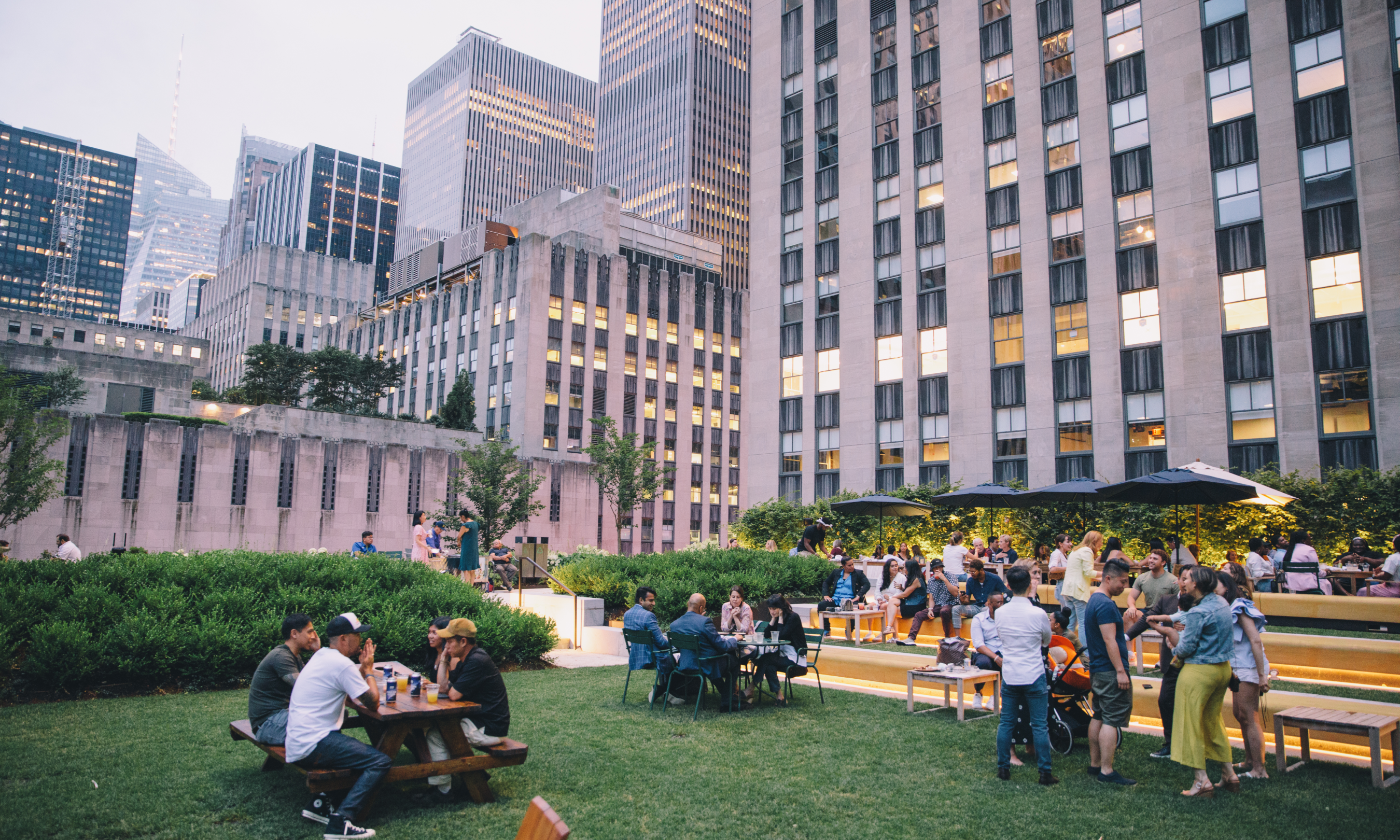 Visitors on the Great Lawn at Radio Park at twilight