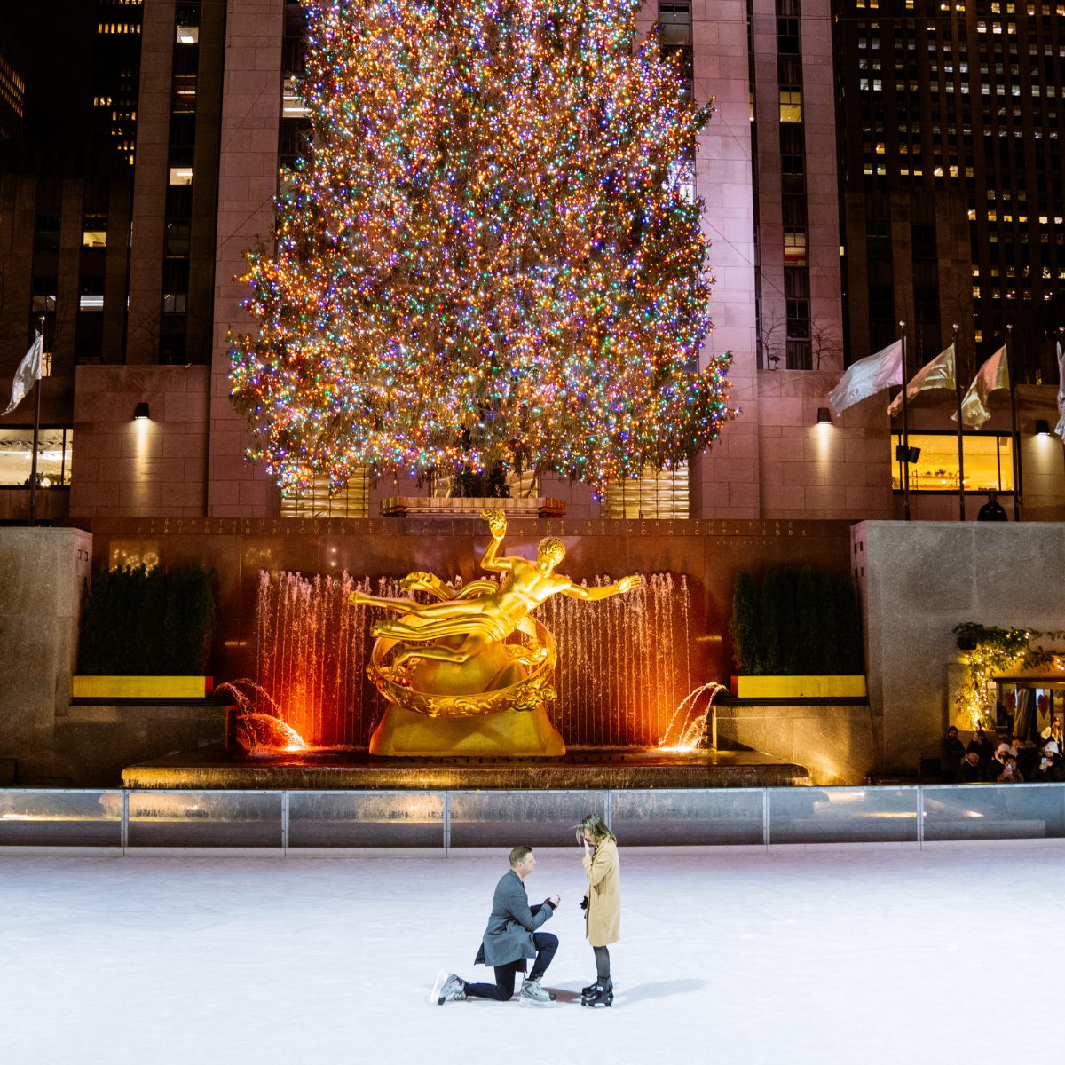 an engagement on the rink at rockefeller center