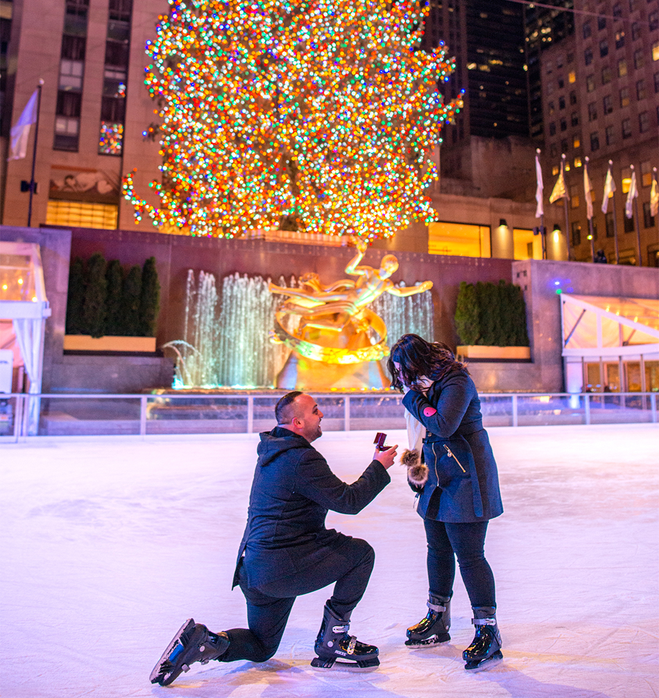 an engagement on the rink at rockefeller center