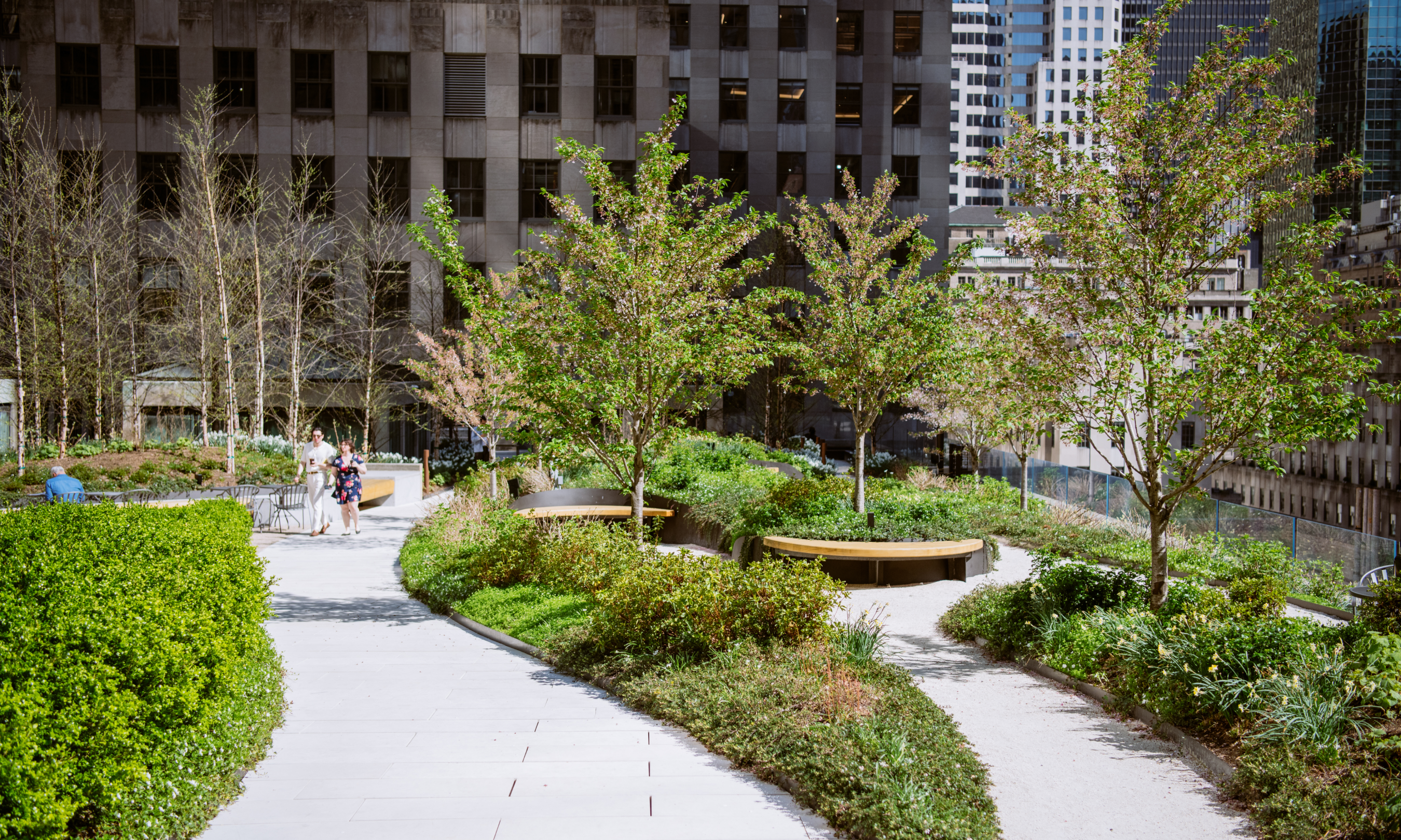 Two people walking on a pathway at Radio Park