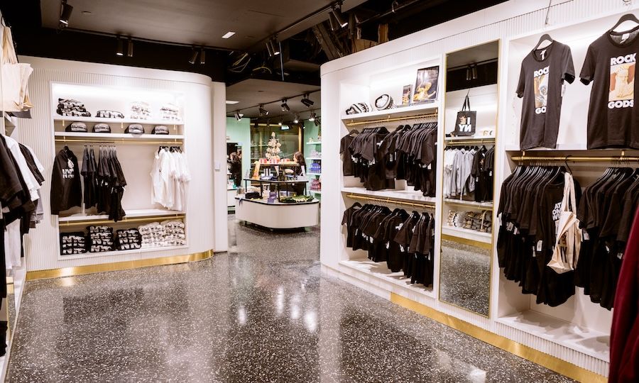 Clothing and tote bags on display at the Top of the Rock Gift Shop
