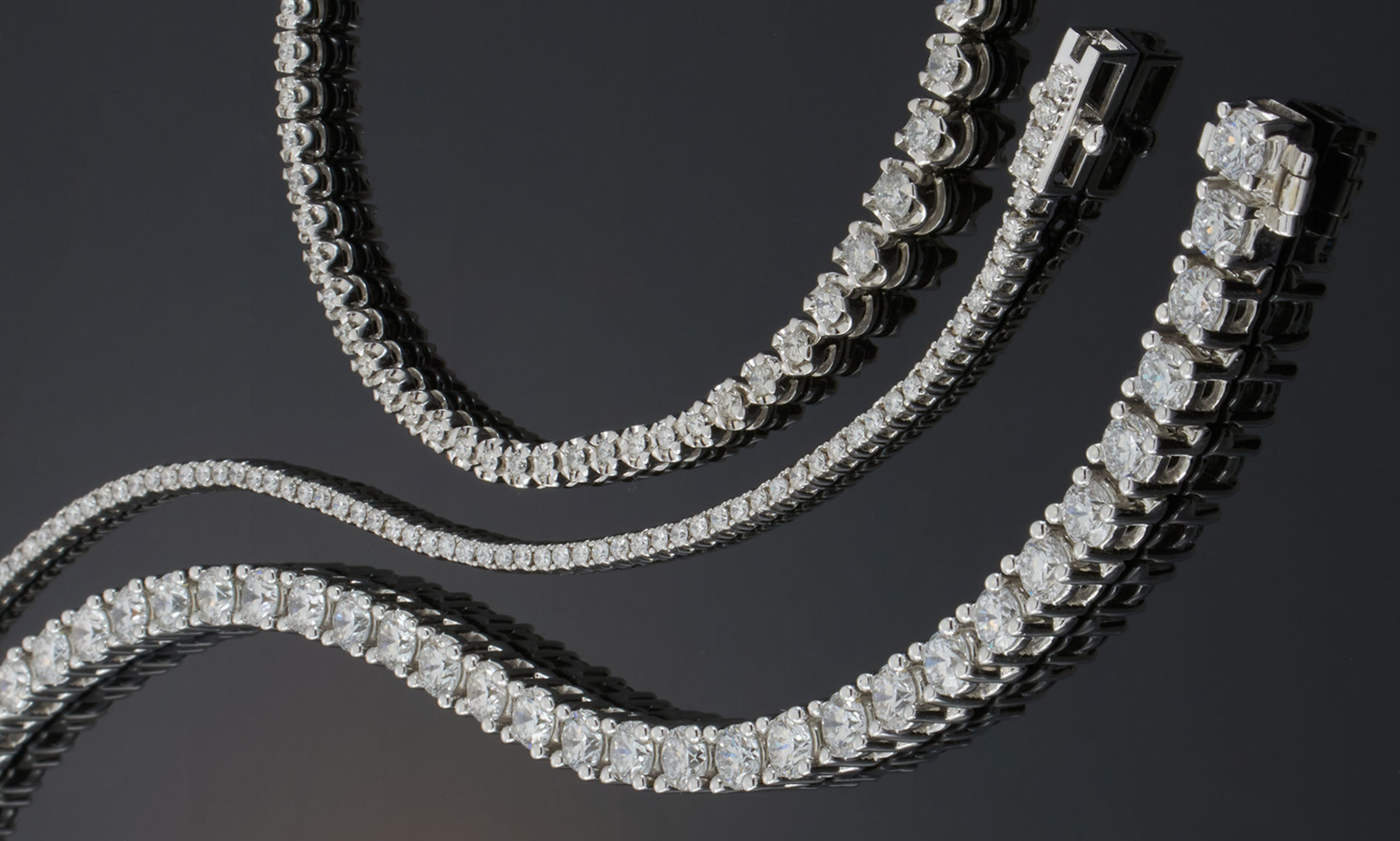 three tennis bracelets